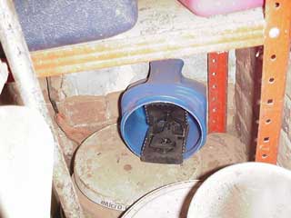 TomCat rat trap, set inside container