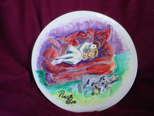 ceramic painting of man and dog on sofa, puppy Bones on floor